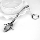 Chaveiro Vassoura Voadora – Emblema da Academia de Magia - Hogwarts™ Express